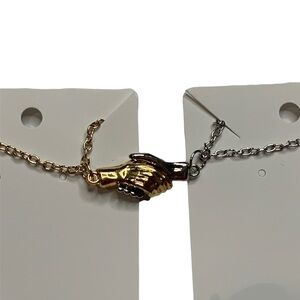 Matching holding hands necklaces